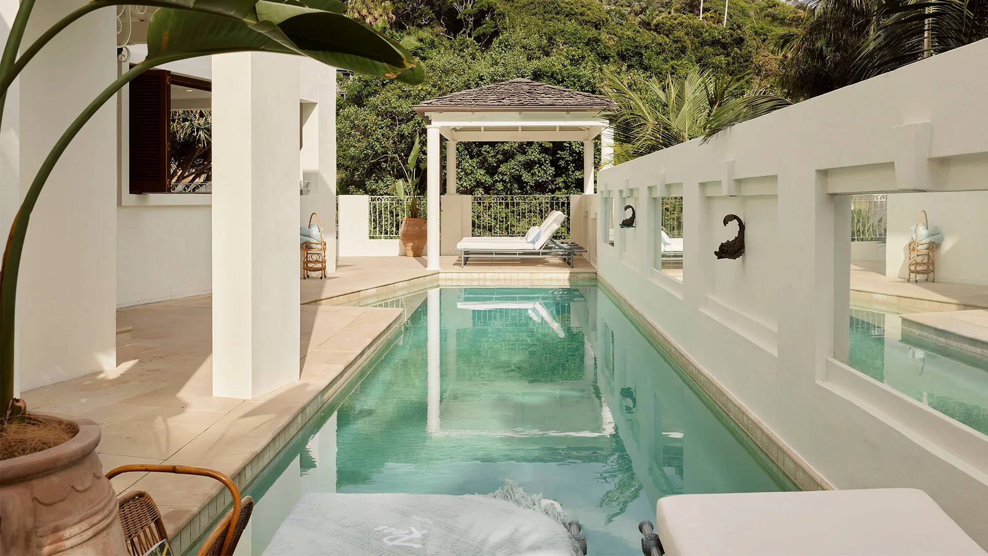 A quiet pool composition representing wellness retreats.